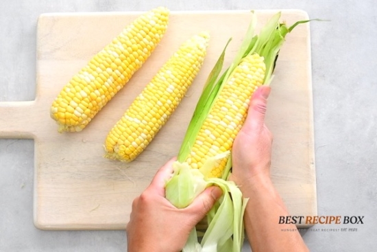 Shucking corn