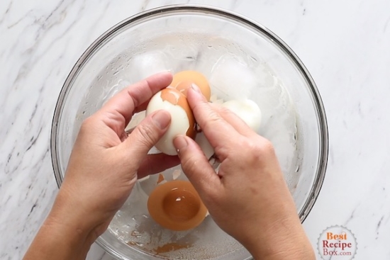 Peeling a hard boiled egg