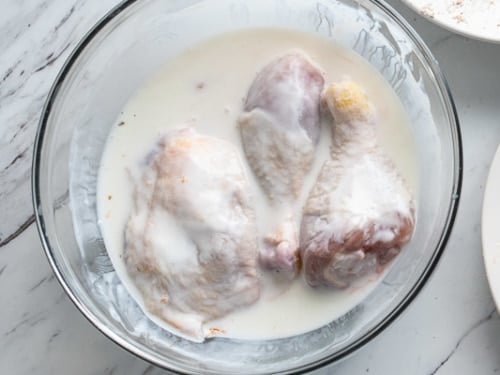 Chicken soaking in buttermilk