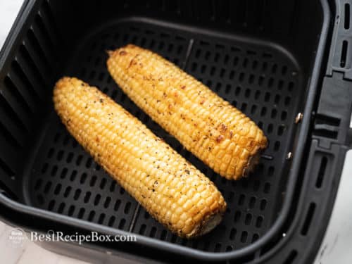 Air fry the corn on the cob until cooked and crispy