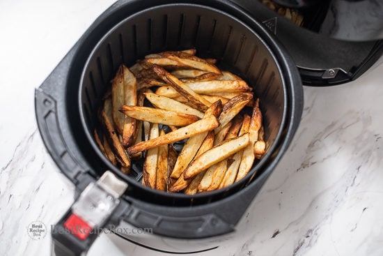 Cooked fries in the air fryer basket