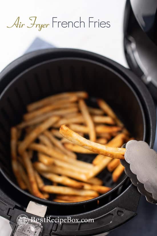 Healthy Air Fryer Frozen French Fries Recipe in a basket with tong