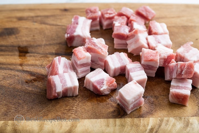 cubed meat on a cutting board