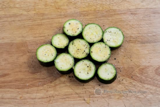 zucchini cut into coin shape with salt and pepper