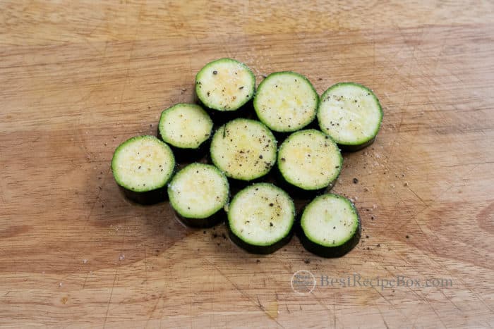 zucchini cut into coin shape with salt and pepper