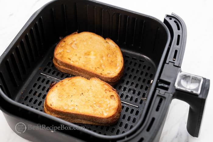 Grilled cheese sandwich in air fryer basket