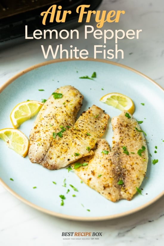 air fryer white fish recipe on plate with lemons 