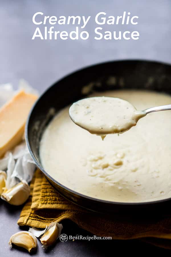 Homemade Alfredo Sauce Recipe and Easy Creamy Garlic Cream Sauce in cooking pan with spoon