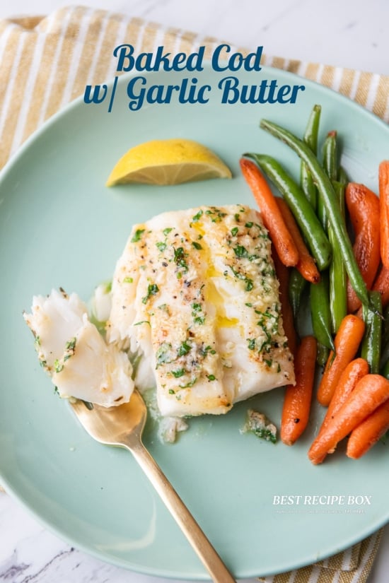 baked cod with vegetables on plate 