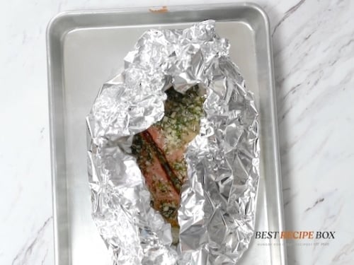 Foil folded over salmon