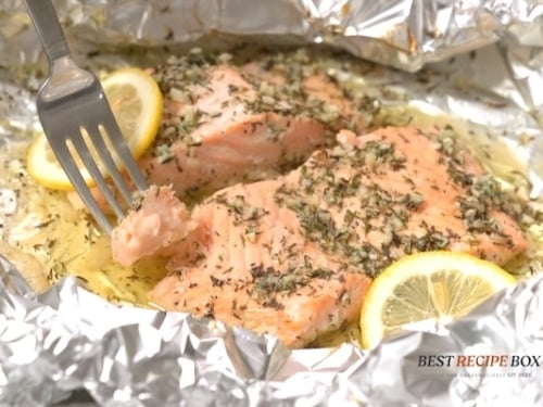 Forking a bite of salmon