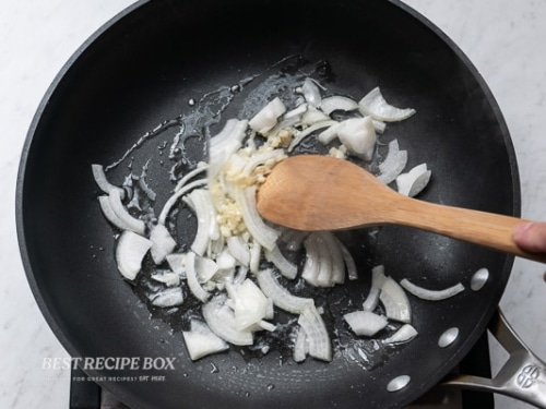 Cooking onions and garlic in pan