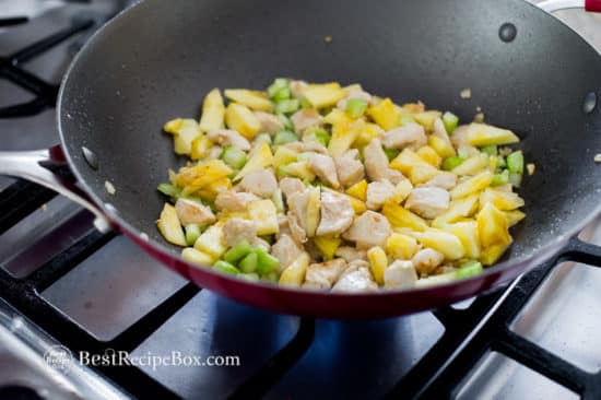add pineapple to chicken in pan