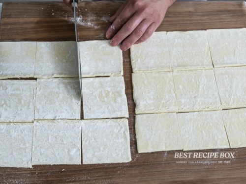 cutting puff pastry dough into squares