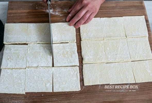 cutting puff pastry dough into squares