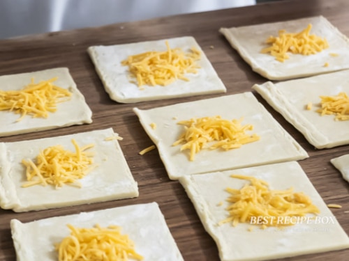 grated cheese in center of puff pastry dough