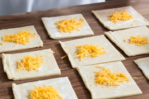 grated cheese in center of puff pastry dough