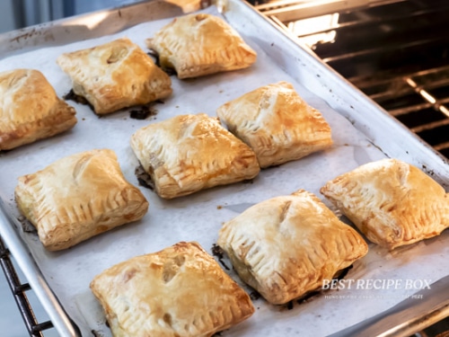 baked sausage cheese puff pastry on sheet pan