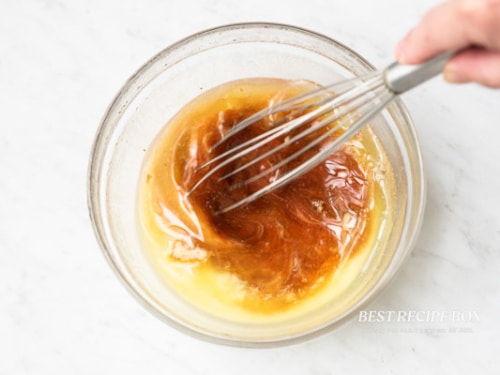 Whisking together sauce ingredients