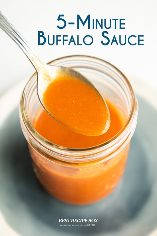 spoonful of best buffalo sauce recipe in jar 