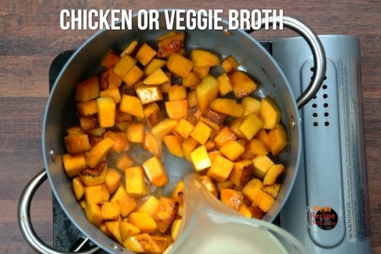 Adding broth to browned butternut squash
