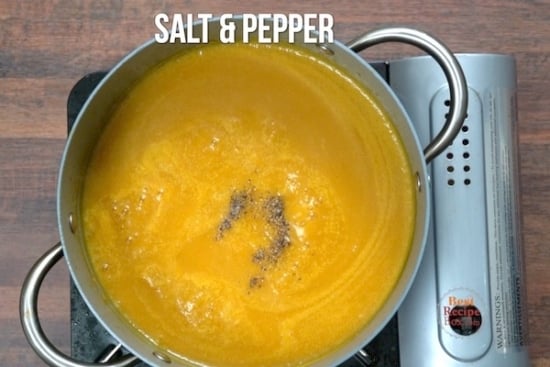 Adding salt and pepper to soup