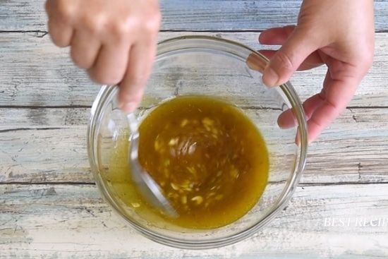 Stirring marinade with a spoon
