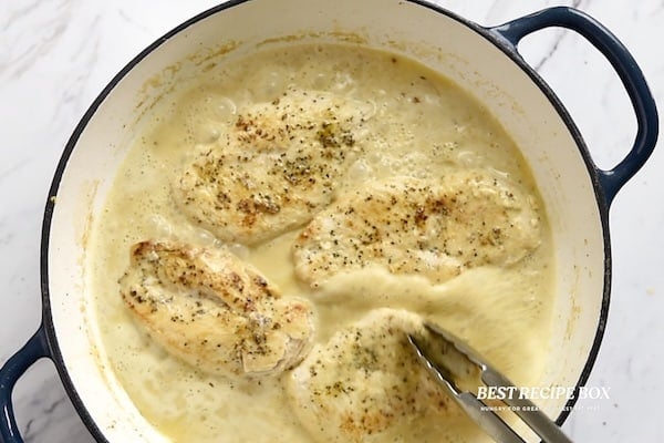 adding chicken to sauce
