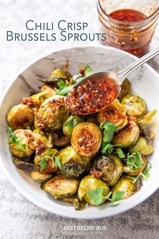 adding spoonful of chili crisp brussels sprouts