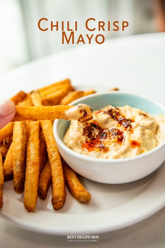 fries dunked in chili crisp mayo