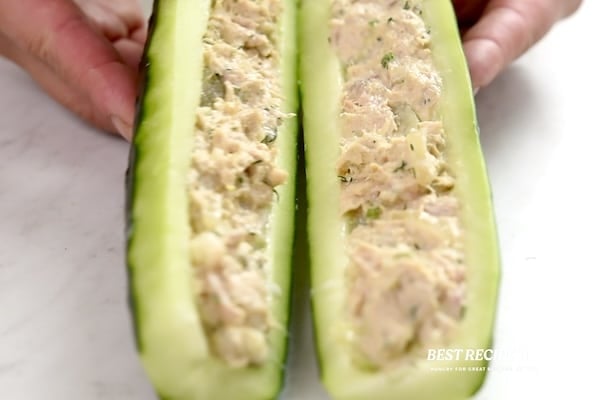 Filled cucumbers being placed together