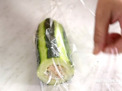 Wrapping cucumber sub in plastic wrap