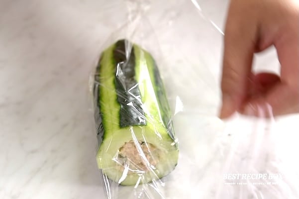 Wrapping cucumber sub in plastic wrap