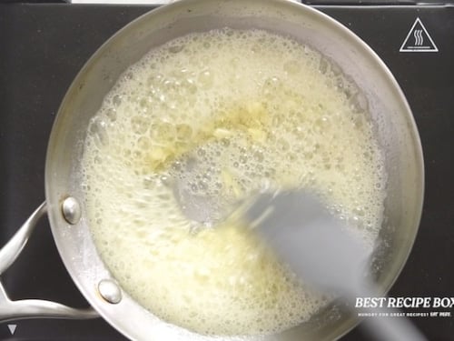 Butter and garlic cooking in a pan