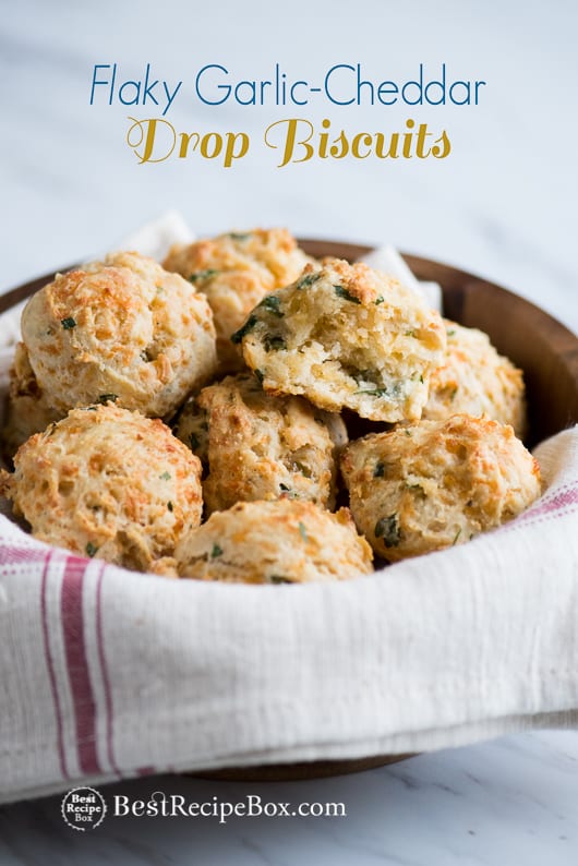 Flaky Garlic Cheddar Drop Biscuits in a wooden bowl 