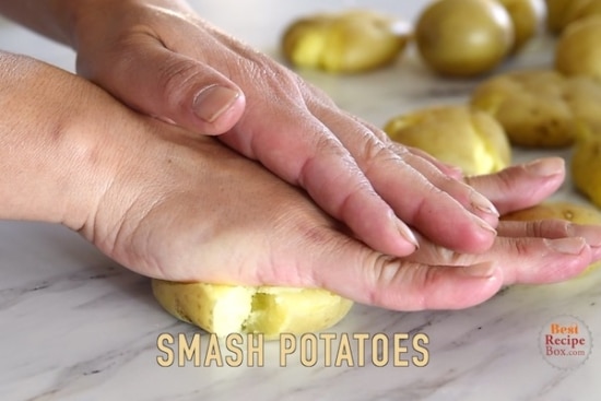 Smashing potato with palm of hand