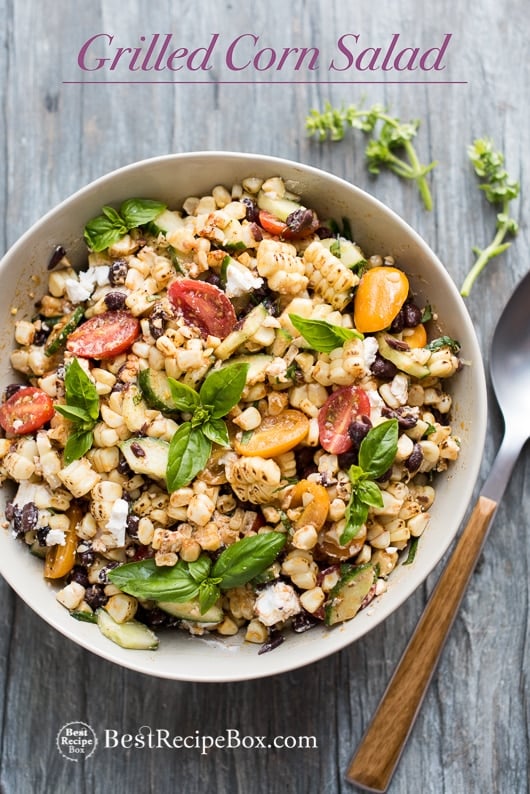 Summer Grilled Corn Salad with Black Beans, Tomatoes, Basil, Feta Cheese in bowl with spoon