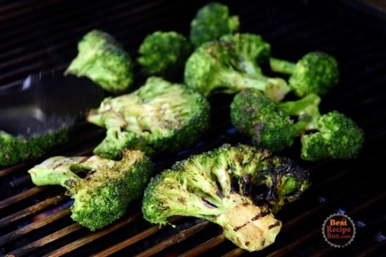 Broccoli nearly finished being grilled