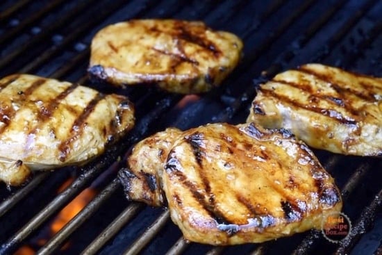 Cooked pork chops on grill