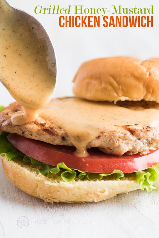 Grilled Honey Mustard Chicken Sandwich with Easy Honey Mustard Sauce Recipe on a cutting board 