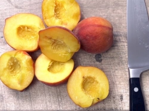 Peaches halved and pitted
