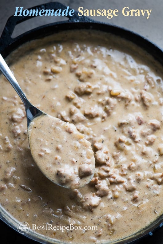 Homemade Sausage Gravy Recipe for Biscuits and Gravy Breakfast in a cast iron skillet with spoon 