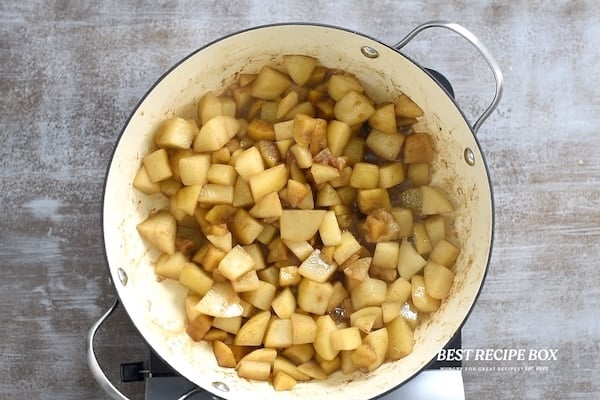 Cut and seasoned fruit in pan