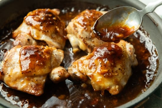 Basting chicken with sauce