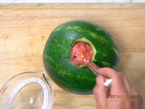 Ladling out extra watermelon