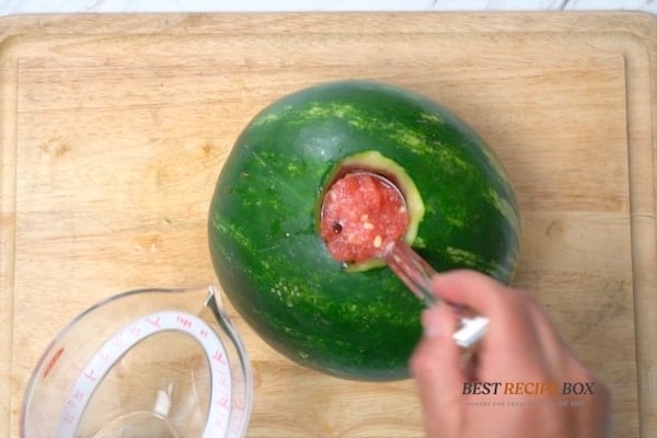 Ladling out extra watermelon