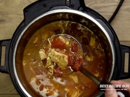 Ladle full of chicken tortilla soup