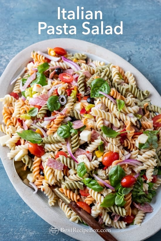 Quick and Easy Italian Pasta Salad with Salami, Cheese, Basil on plate