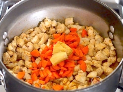 Carrots and ginger added to pot