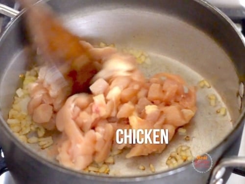 Chicken added to pot